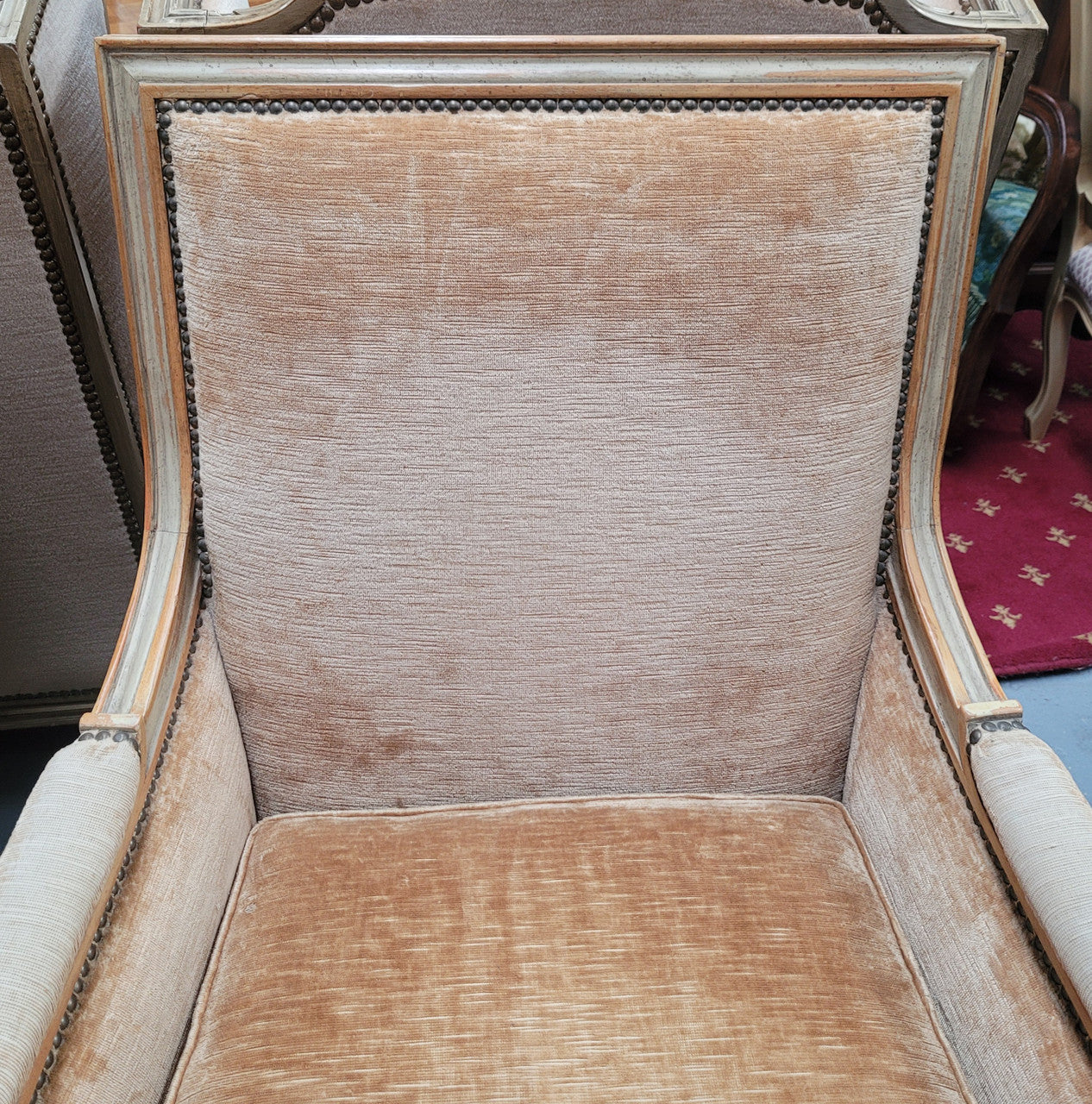 Pair of Louis XVI style painted arm chairs with carving & fluted legs. They have been sourced from France and the fabric is in good used original condition. Please view photos as they help form part of the description.