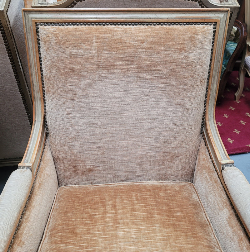 Pair of Louis XVI style painted arm chairs with carving & fluted legs. They have been sourced from France and the fabric is in good used original condition. Please view photos as they help form part of the description.