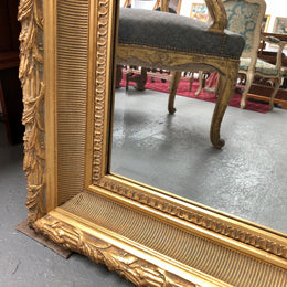 Very large French style mirror with beveled glass. In very good original condition.