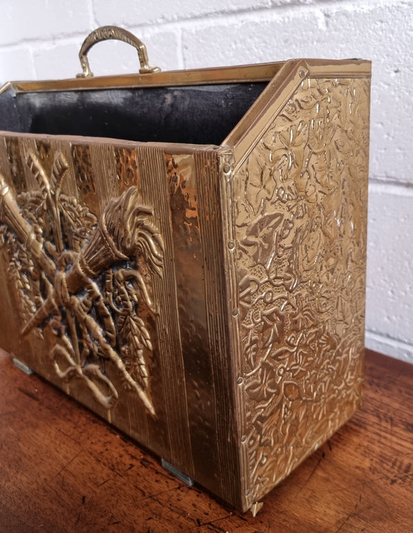 Vintage Brass repousse hammered magazine holder rack. Sourced locally and in good original condition, please view photos as they help form part of the description.