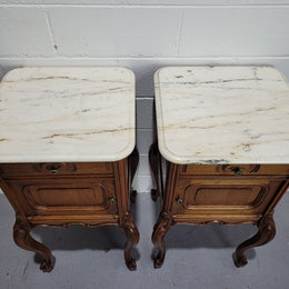 Pair of Louis XV style bedside cabinets with beautiful marble tops and one drawer and single cupboard for all your storage needs. In good original detailed condition.