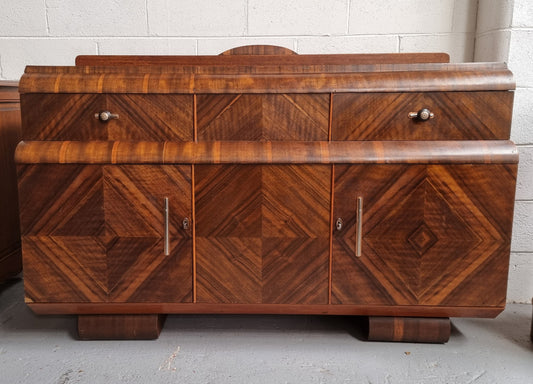 Vintage Walnut Art Deco “Waterfall” sideboard buffet with two drawers and two doors. It is in good original condition and has been sourced locally.