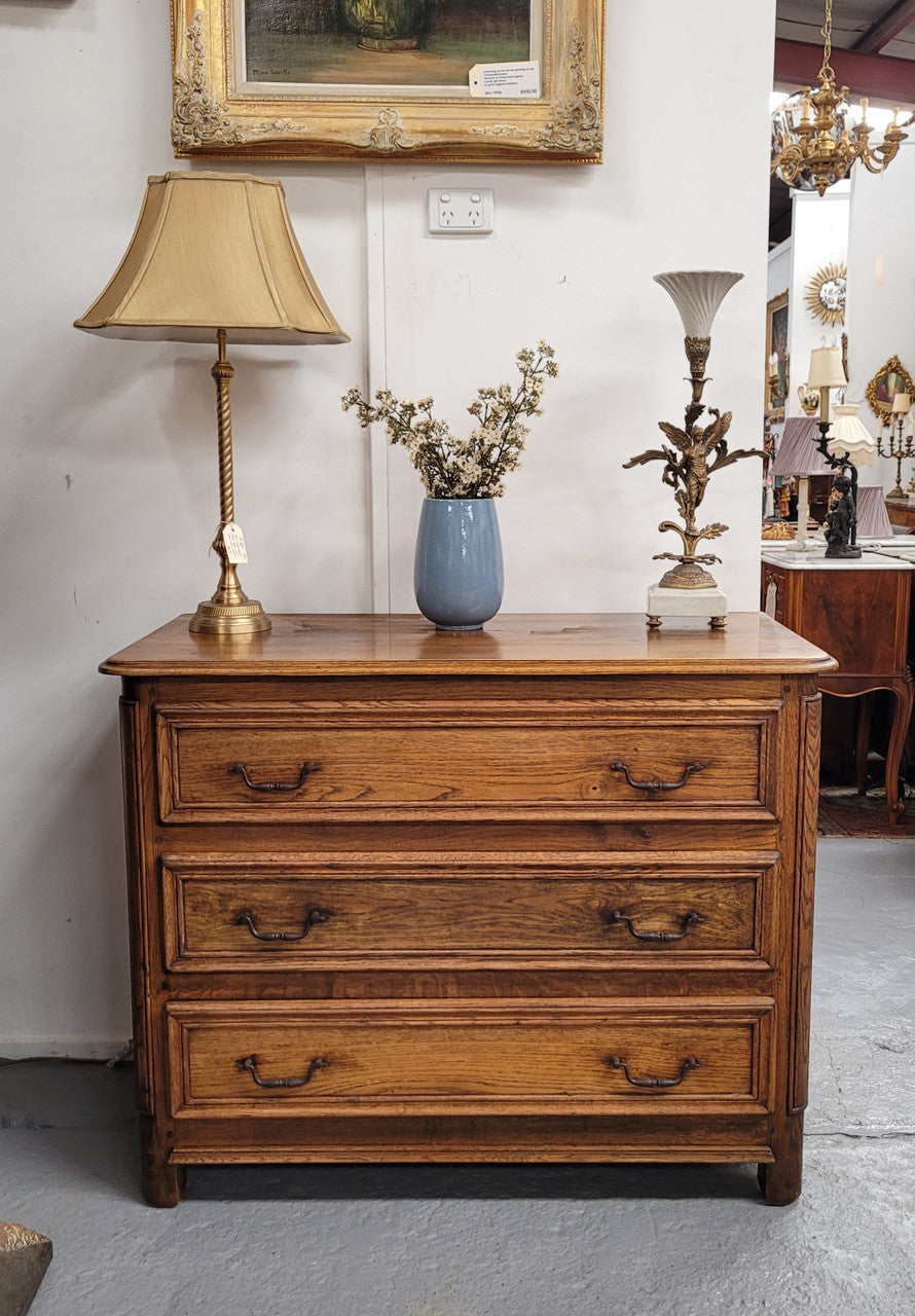 French solid Oak Louis 14th style chest of three drawers. It has three large spacious drawers and it has been sourced from France. It is in good original detailed condition.
