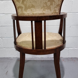 Charming Edwardian inlaid walnut upholstered armchair. In good original condition.