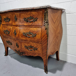Attractive French marble top Louis XV style three drawer commode with decorative ormolu mounts. In good original detailed condition.