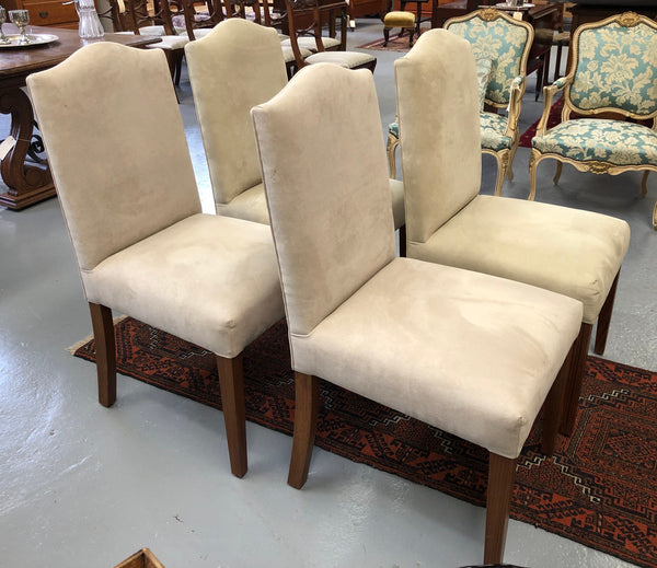 Beautiful set of four upholstered taupe/ light fawn dining chairs which are very comfortable to sit in. They are in good original condition.