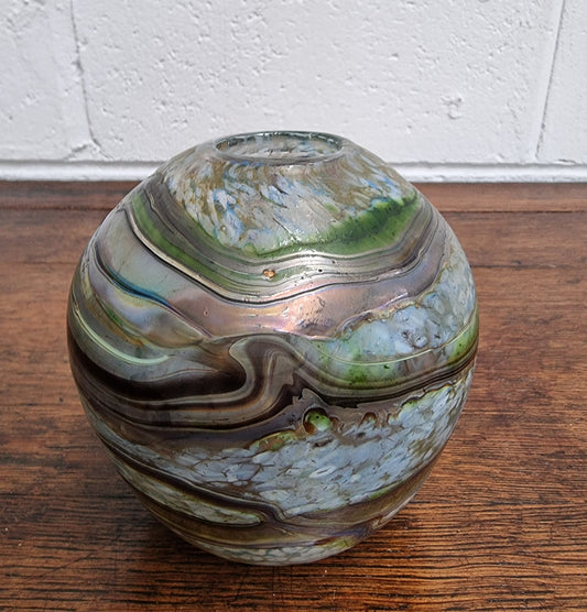 A stunning gallery quality Australian studio art glass vase masterfully handcrafted and signed by the renowned glass artist Don Wreford in 1984. Don Wreford was one of Australia's leading glass blowers and an artist of international renown. Don worked from his studio in Daylesford, Victoria, where he created unique and artistic pieces known for their stunning forms and rich color combinations. Don's work is exhibited in leading galleries and features in prominent private and public collections around the wo