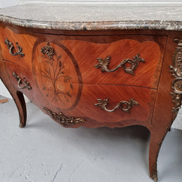 Beautiful French walnut Louis XV style two drawer commode. With a lovely floral marquetry inlaid design and marble top. It is in good original detailed condition.