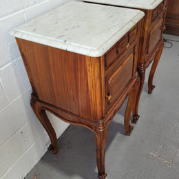 Pair of stunning Louis XV style French Walnut white marble top bedside cabinets. They have one drawer and a cupboard that is marble lined. The marble has been polished and they are in good original detailed condition.