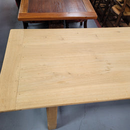 French raw Oak stretcher based refectory table. Features raw wood that could be used as is for a distressed look, or finished and waxed for a more refined look. Sourced from France and in good original condition.