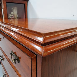 Lovely Antique English walnut tallboy/ chest of drawers. There are five drawers which all differ in sizes and have lovely hardware. It is in good original detailed condition.