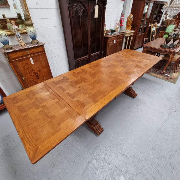 Amazing French Oak Renaissance style parquetry top extension table. Beautiful parquetry top and amazing detailed carvings on the legs. It extends to 306 cm long when fully extended. Sourced from France and in good original detailed condition.