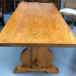 A French Style Oak stretcher base table with amazing wood grain. Can comfortable sit 6-8 people and is in original detailed condition.