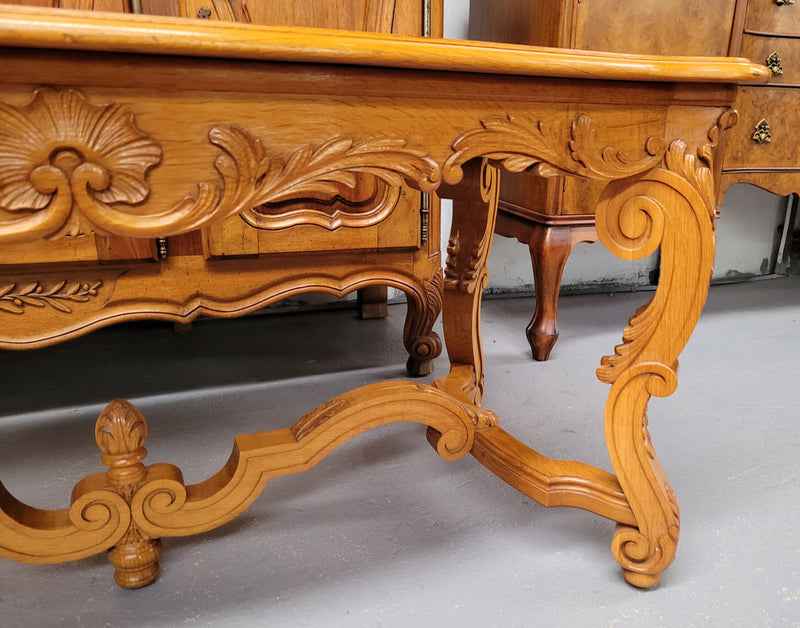 French Oak parquetry top coffee table with decorative carved base. It is in good original detailed condition.