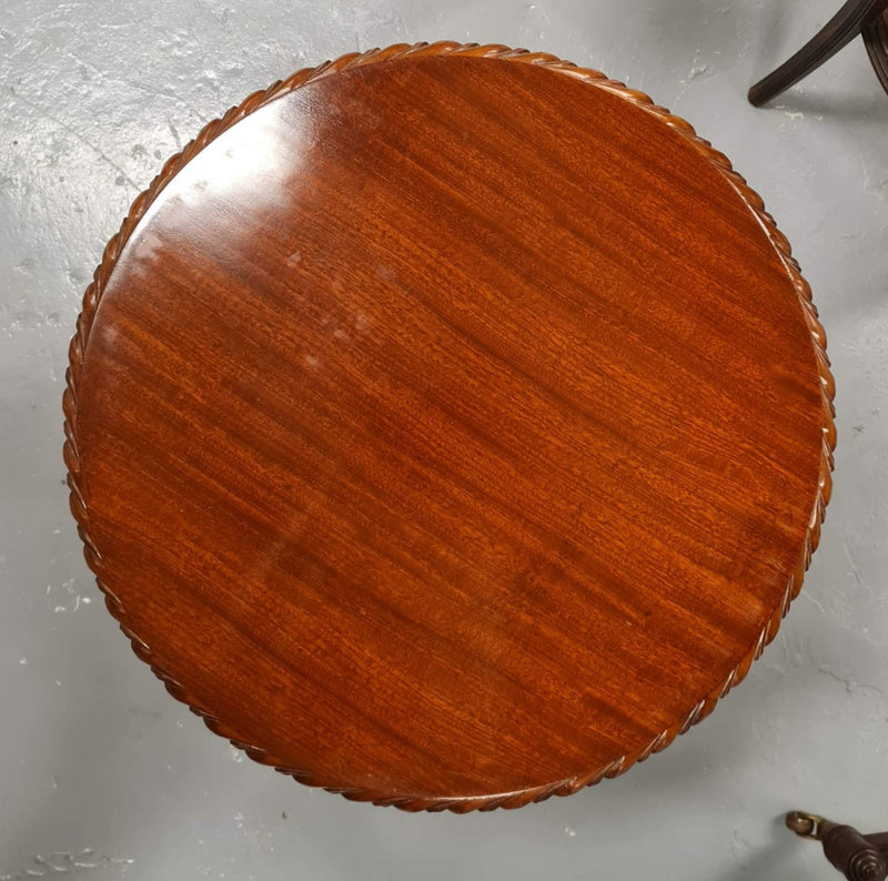 A beautiful round Mahogany Chippendale style coffee table with a glass top. In good original detailed condition.