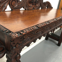 Superb 19th Century Gothic style hall/console table. It has umbrella and walking stick holders on both sides. In good original detailed condition.