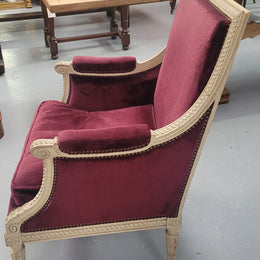 Louis 16th Style high back upholstered chair with maroon velvet fabric, decorative carvings and original paint. It has been sourced from France and in good original condition.