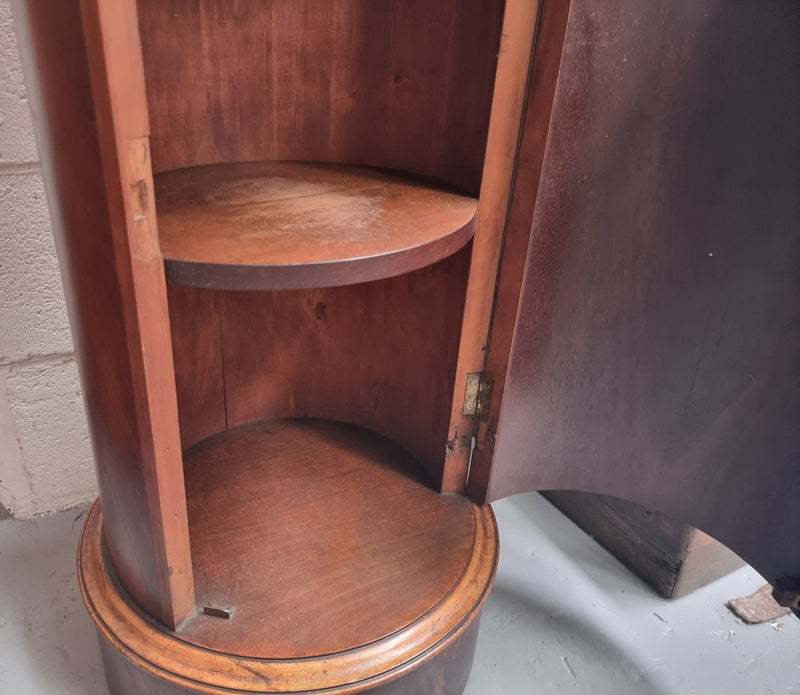 Unusual Empire flame Mahogany cylindrical marble topped bedside/pedestal. Would make an ideal pedestal with added storage inside or could be used as a bedside. Sourced from France and is in good original detailed condition.