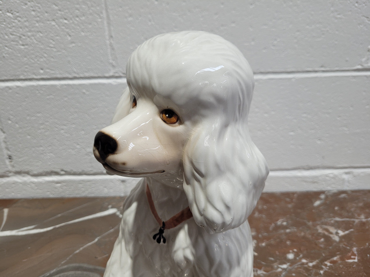 Vintage Italian ceramic Poodle figurine. It is beautifully detailed and in good original condition with no chips or cracks does have crazing to glaze.