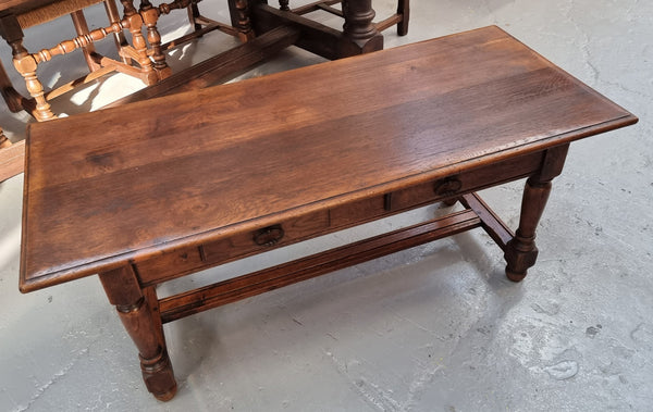 Beautiful French oak 2 drawer coffee table. In good original detailed condition.