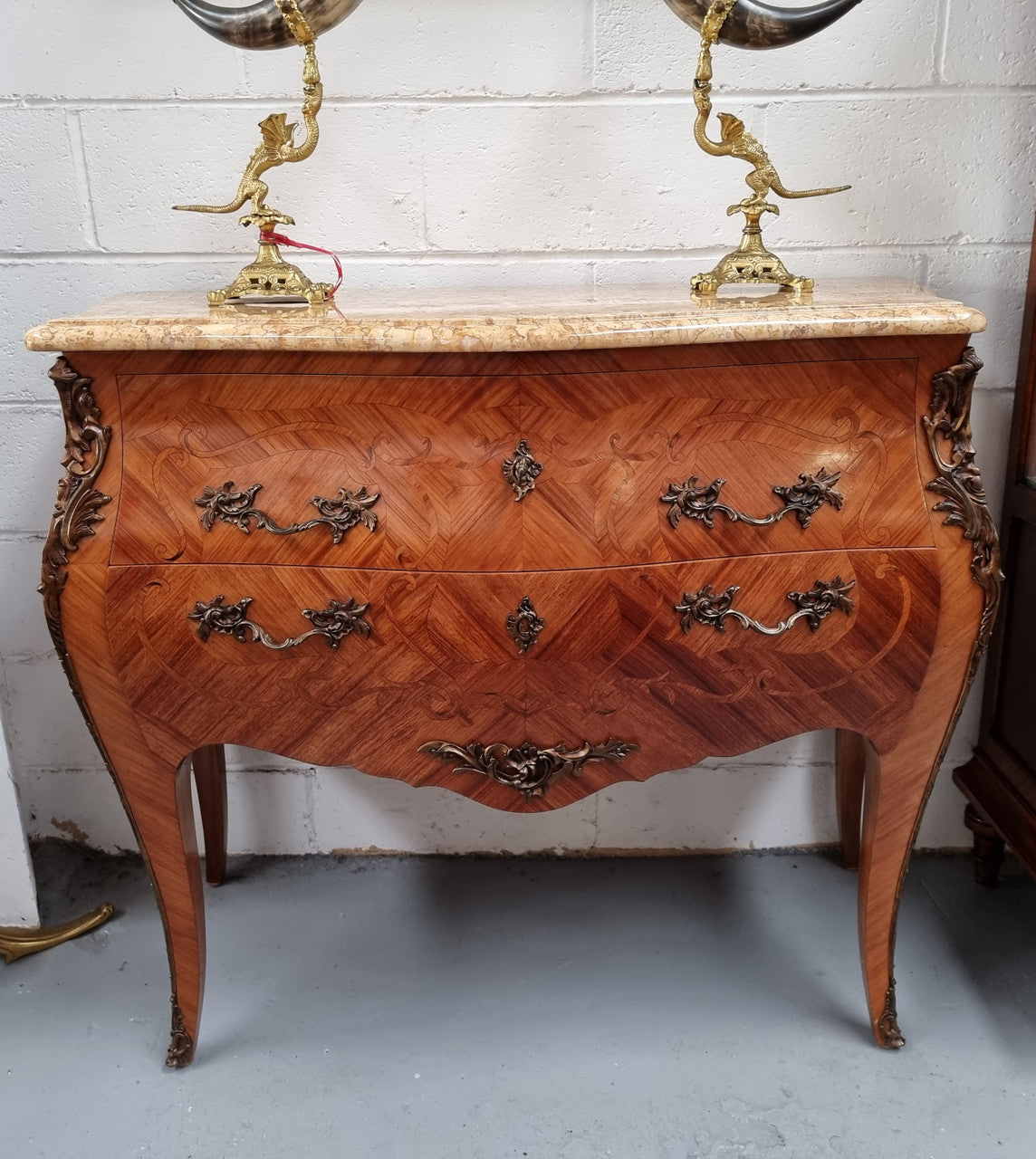 French marquetry inlaid Kingwood marble top commode. It has two drawers and beautiful mounts. Is in good original detailed condition.