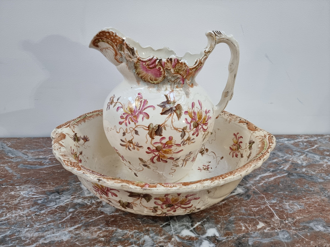 Delightful late Victorian floral English ceramic Jug and Basin set. Marked on base B&T. In good condition please view photos as they help form part of the description.