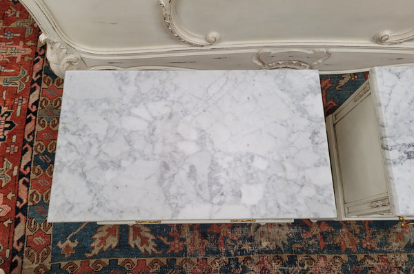 Attractive pair of Vintage French Louis 16th style two drawer marble topped bedsides. They have been sourced from France and are in good original condition.