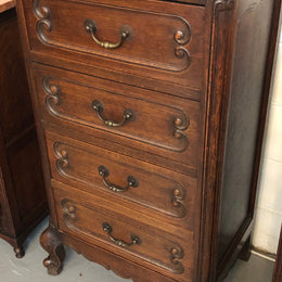 Antique French Oak Louis XV style four drawer bedside cupboard/side cupboard. In good original detailed condition. Circa 1910.