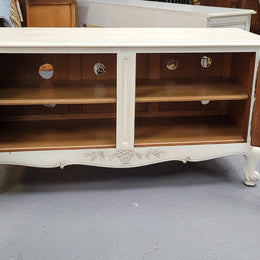 Louis XV style chalk painted two door cabinet which would also make an ideal TV cabinet. It has been sourced from France and in good original detailed condition.