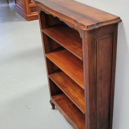 Compact French Louis XV Style Walnut four shelf open bookcase. In good original detailed condition.