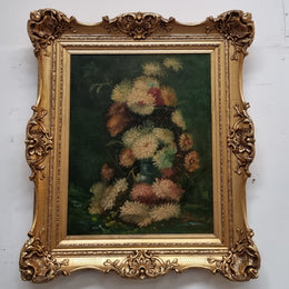 Beautifully framed moody floral oil painting on canvas of Chrysanthemum flowers in a vase with a ornate gilt frame. In good original condition.