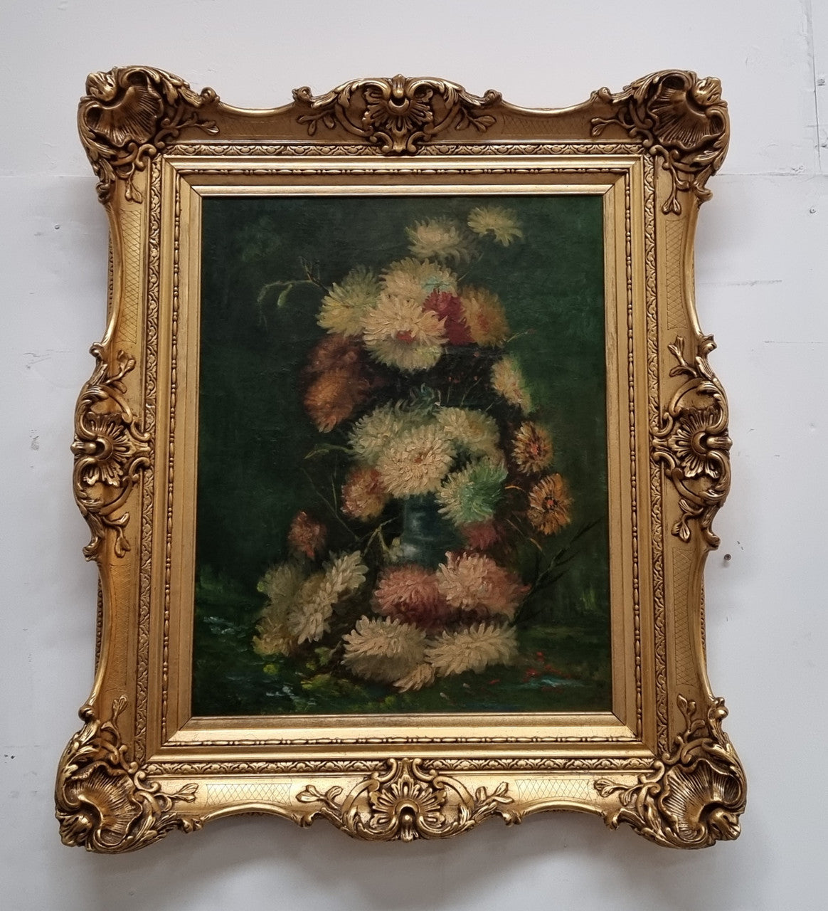 Beautifully framed moody floral oil painting on canvas of Chrysanthemum flowers in a vase with a ornate gilt frame. In good original condition.
