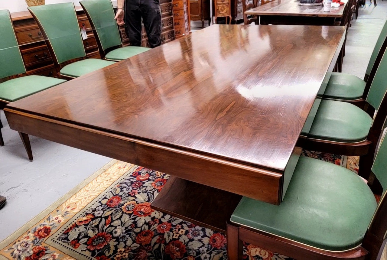 French Art Deco Figured Walnut dining table and six chairs. This stylish table also comes with a glass top and can be used with or without it. The chairs are very comfortable and the table can also fit another two chairs at either end making it a 6-8 seater. The table is in good original detailed condition with character marks to the top of table as shown in the pictures. This table and six chairs have been sourced locally.