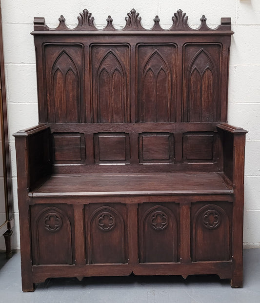 French Oak 19th Century gothic style high backed hall seat. Amazing detailed carving and is good detailed condition.
