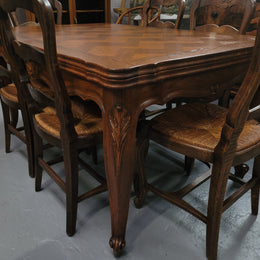 French Oak Louis XV style parquetry top extension table. It can sit six people when not extended and eight when fully extended. It has been sourced from France and is in original detailed condition.