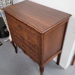 French Oak Louis XV style three drawer commode. It has been sourced from France and has decorative handles and carvings. It is in good original detailed condition.