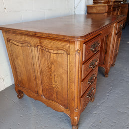 Beautifully carved french oak, faux partners desk with a lovely parquetry top and 6 drawers and 1 cupboard . In good original condition.