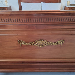 Louis XVI style Mahogany Queen size bed on original castors. This bed has beautiful carved details and and Ormolu mounts in good original detailed condition