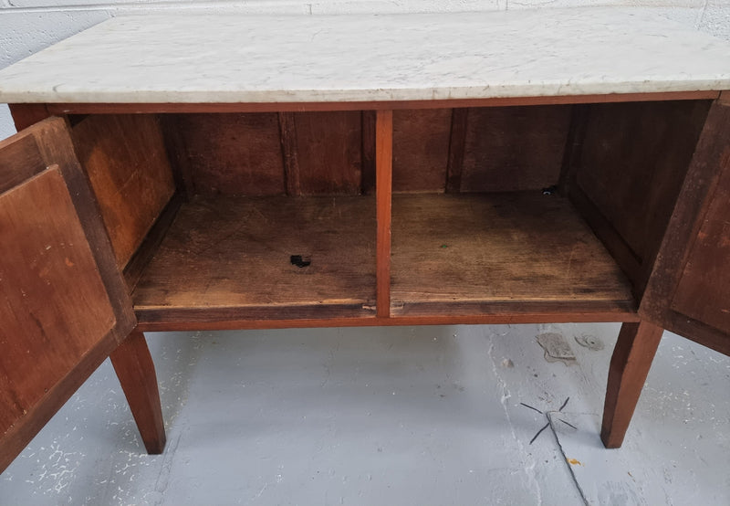 Blackwood two door white marble top cabinet. This would be ideal to be used as an entertainment unit, a TV stand or TV cabinet. In good original condition.