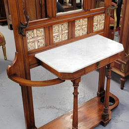 Late Victorian Arts and Crafts style marble top hall stand. Features three attractive tiles, original hooks and single drawer. In good original condition.