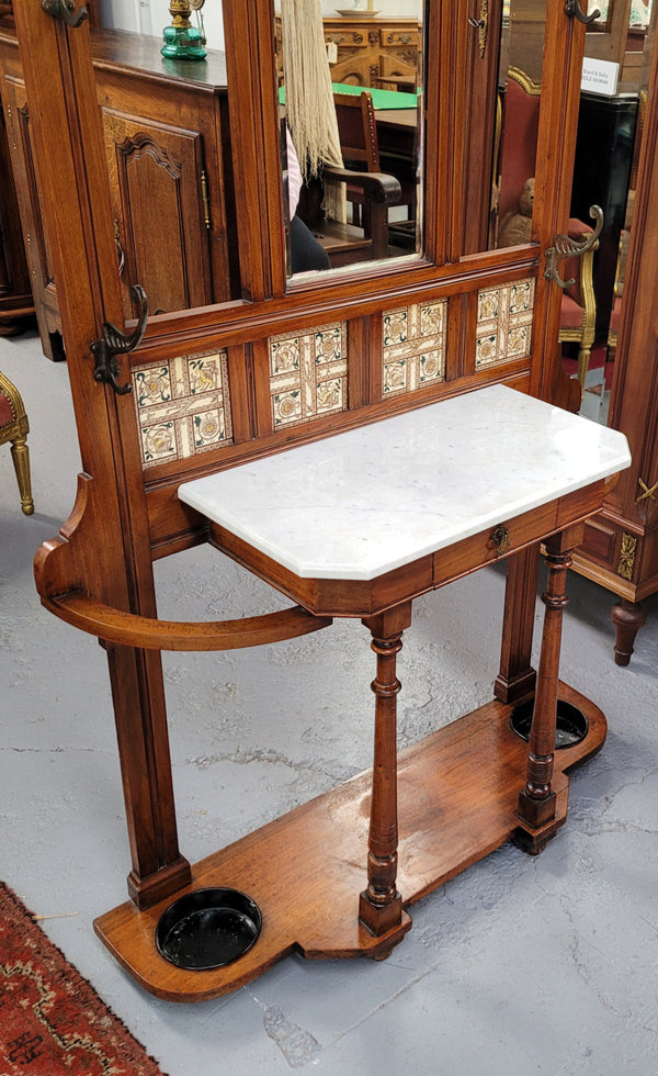 Late Victorian Arts and Crafts style marble top hall stand. Features three attractive tiles, original hooks and single drawer. In good original condition.