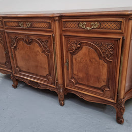 French Burr Walnut/Walnut parquetry top three door and three drawer sideboard. Plenty of storage space and beautiful decorative carvings. In good original detailed condition.