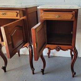 Pair of Louis XV style Walnut bedside cabinets marble top. Circa 1900 and in good original detailed condition.