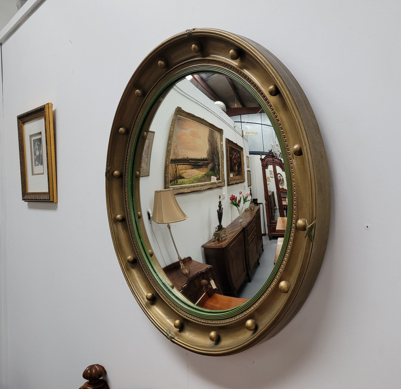 Large round French gilt framed convex mirror. It is a hard to find size with a total diameter of 67 cm. It has been sourced from France and is in good original condition.