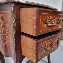 A stunning French petite two drawer inlaid Rosewood commode. In good original detailed condition.