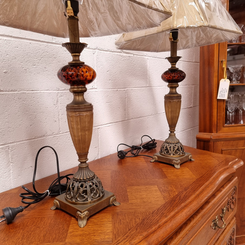 Beautiful pair of metal and glass lamp bases with new gold shades. They are in good original working condition and have been sourced locally.