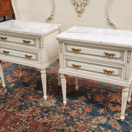 Attractive pair of Vintage French Louis 16th style two drawer marble topped bedsides. They have been sourced from France and are in good original condition.