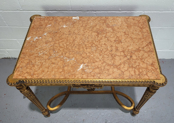 Antique French Louis XVI style gilt center table with a stunning marble top. Featuring stunning ornate carving and it is in great original condition