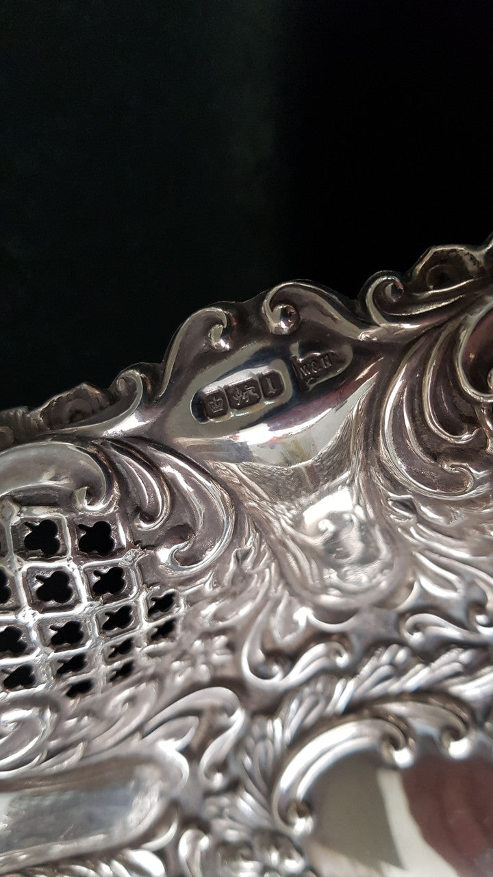 A Sheffield sterling silver bowl with repousse pattern, hallmarked WALKER & HALL and in good original condition.