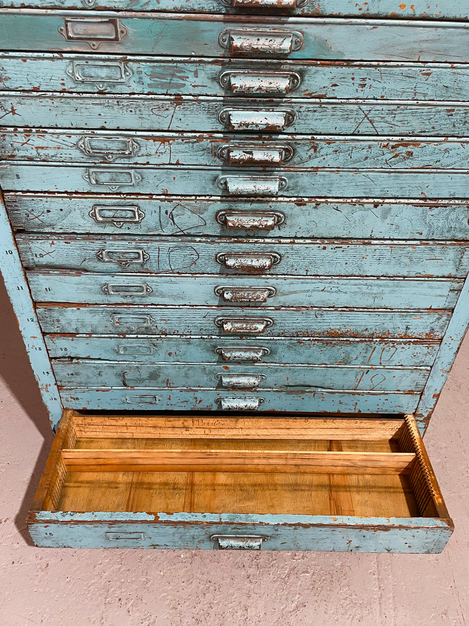 Fabulous set of vintage painted blue printers drawers that have adjustable separators which can be taken out for large papers. The drawers are various sizes and there is a section on top for working on or for storing brushes or tall items . These would be perfect for artists or jewellery pieces or even architects. Such a beautiful piece of industrial furniture.